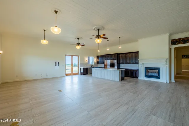 a view of a kitchen with a sink and a fireplace