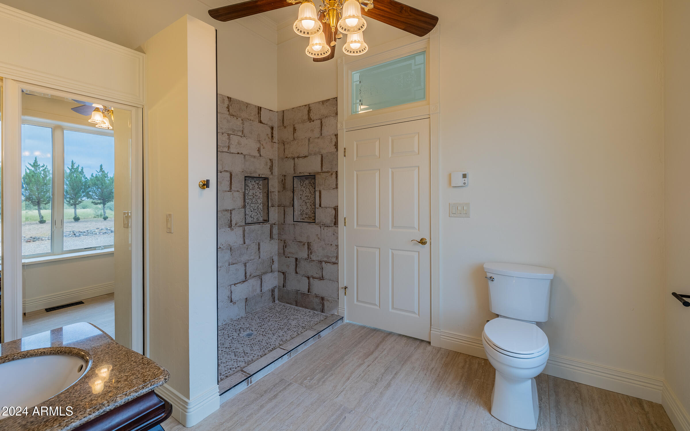 1044 North Dragoon Ranch Road St. David, AZ 85630 - Photo 31 of 57 a bathroom with a sink a toilet and shower