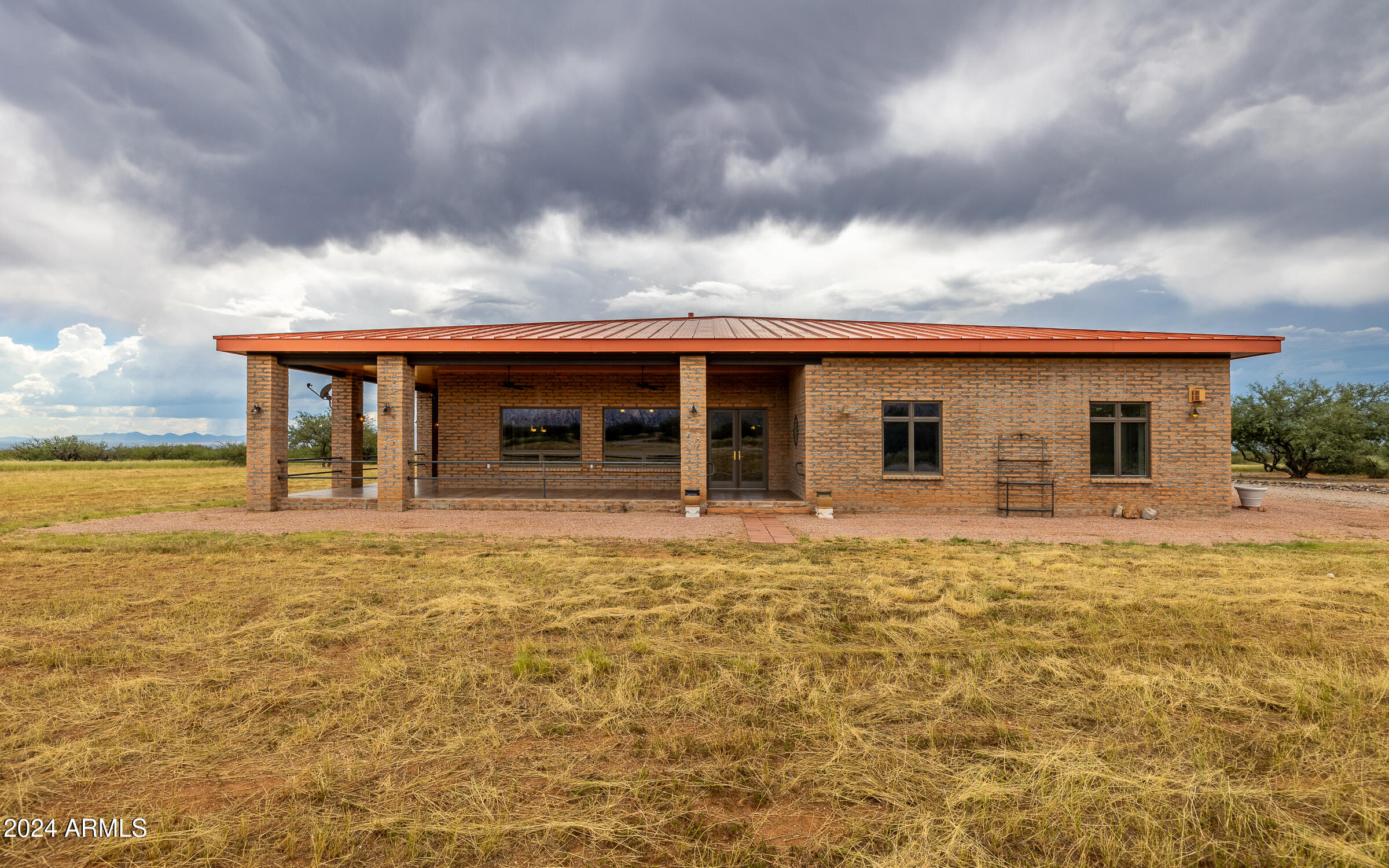 1044 North Dragoon Ranch Road St. David, AZ 85630 - Photo 36 of 57 a backyard of a house with table and chairs