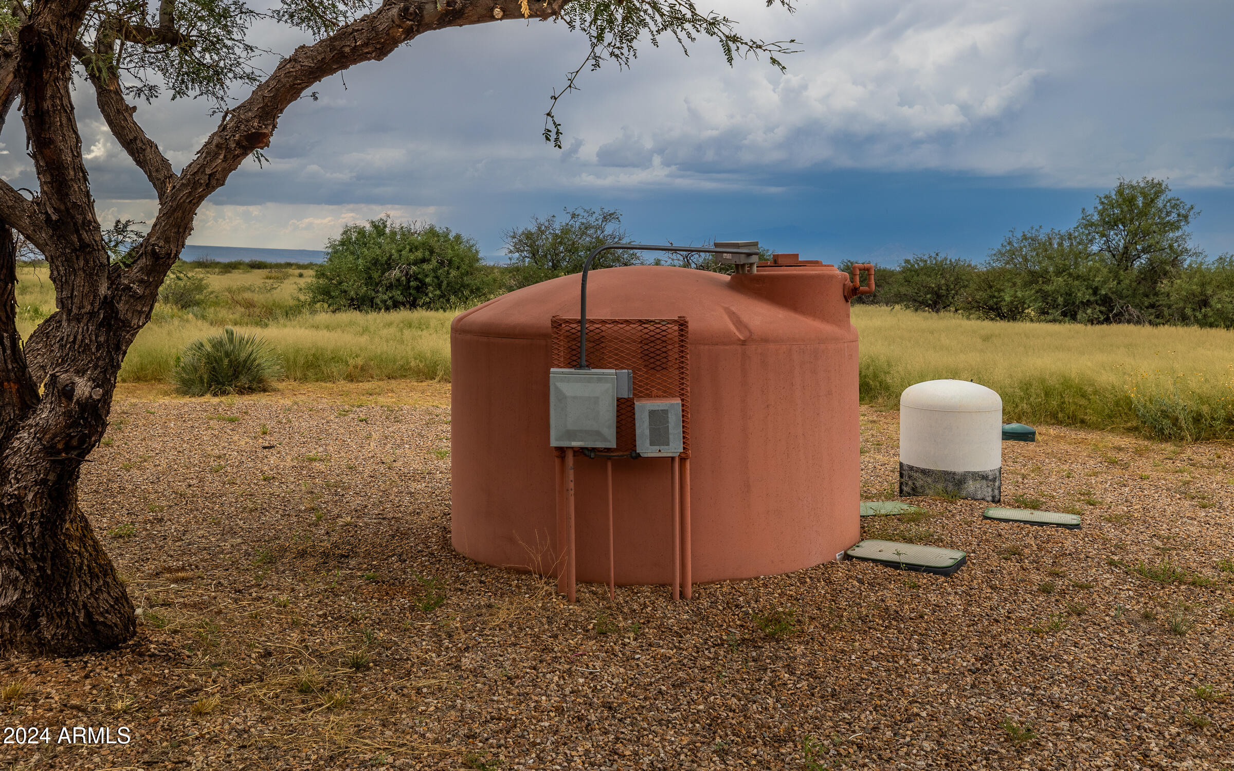 1044 North Dragoon Ranch Road St. David, AZ 85630 - Photo 40 of 57 a aerial view of a house with a yard and a large tree