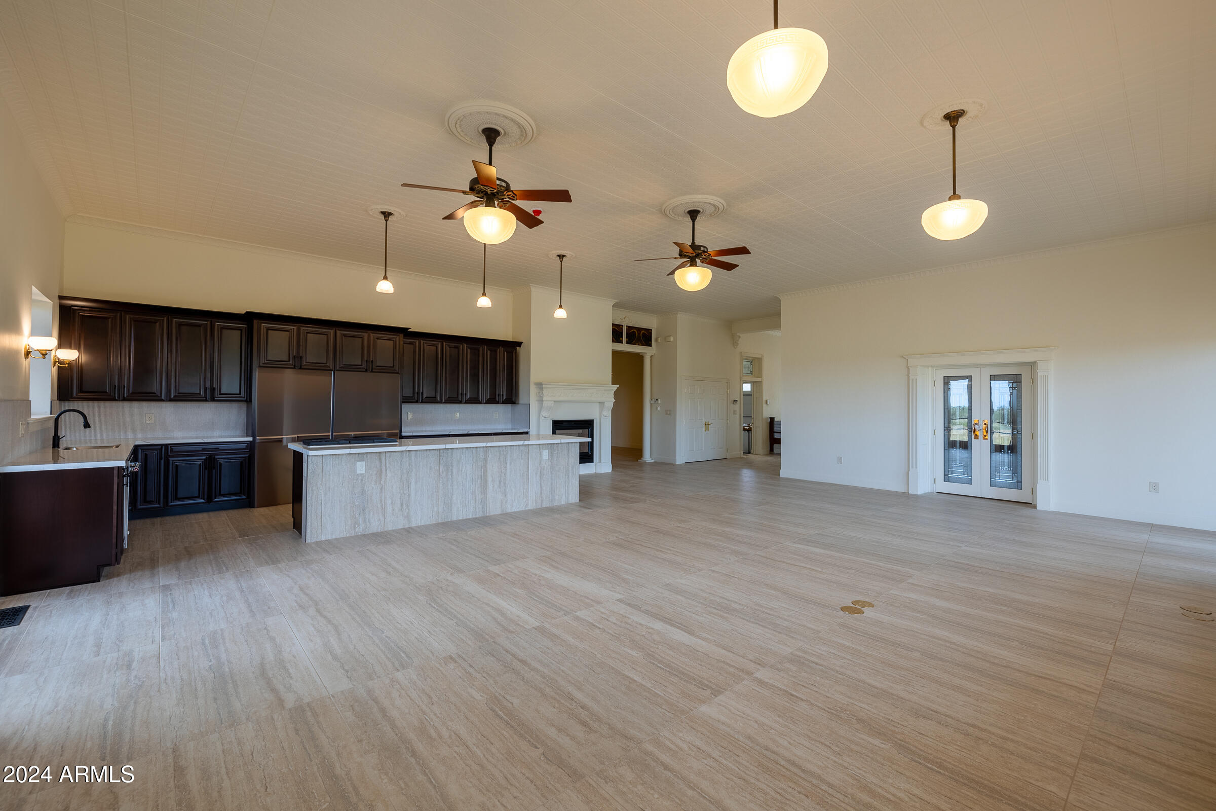 1044 North Dragoon Ranch Road St. David, AZ 85630 - Photo 4 of 57 a view of a kitchen with a sink and a chandelier
