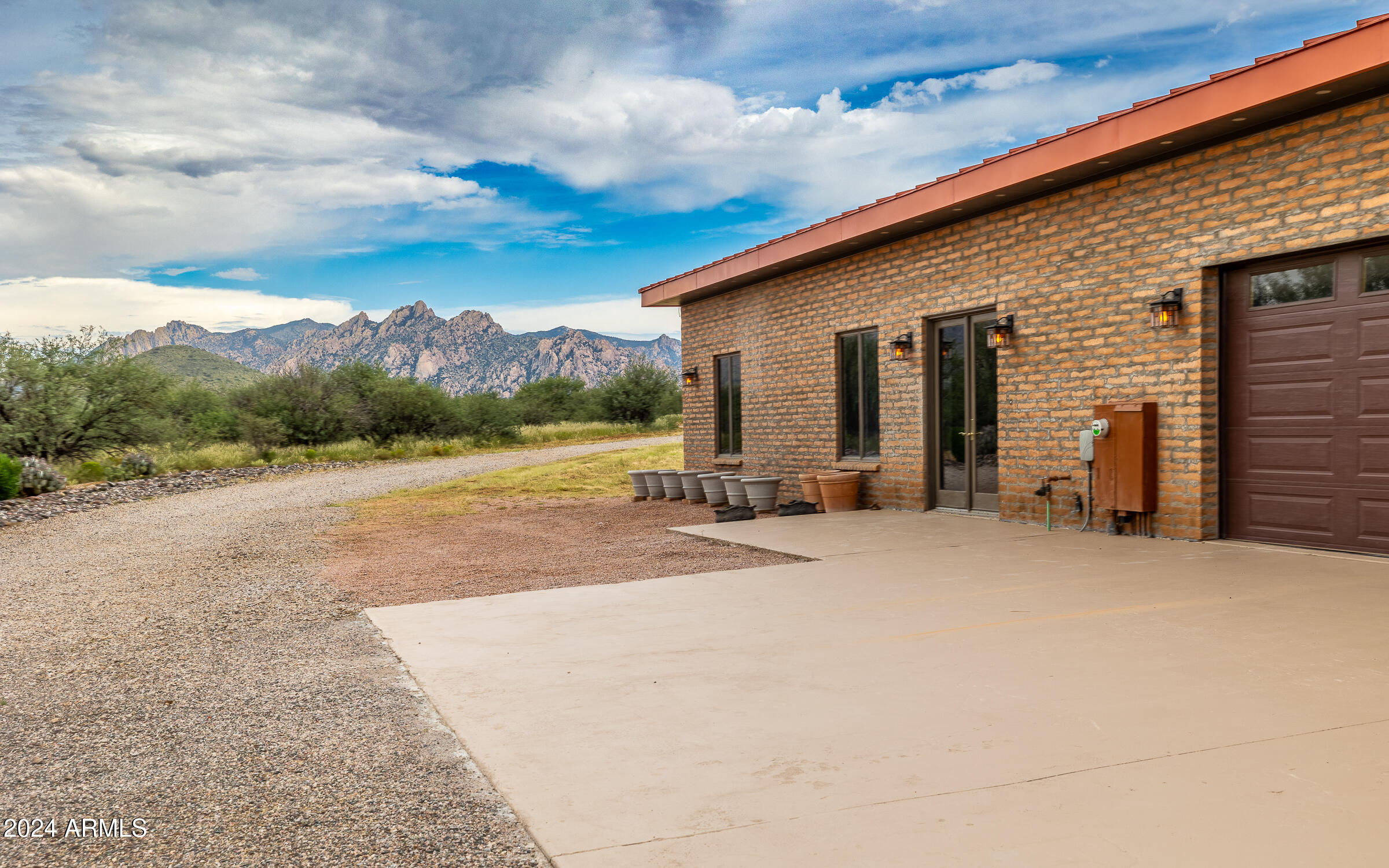1044 North Dragoon Ranch Road St. David, AZ 85630 - Photo 42 of 57 a view of a house with a yard and mountain