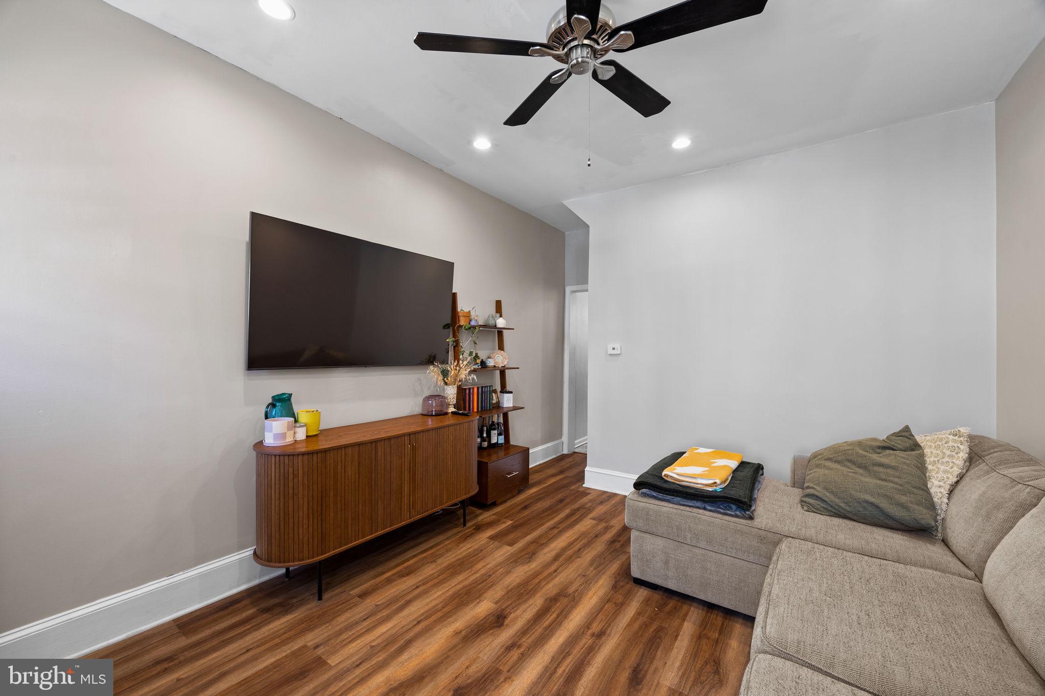 3743 Sharp Street Philadelphia, PA 19127 - Photo 1 of 25 a living room with furniture and a flat screen tv