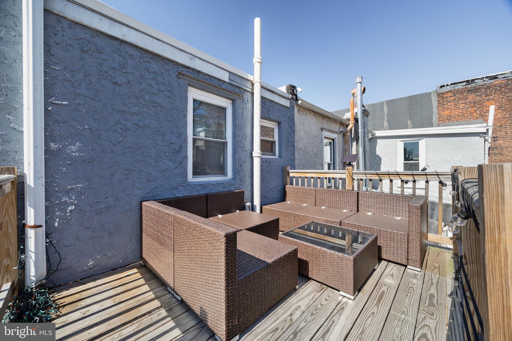 3743 Sharp Street Philadelphia, PA 19127 - Photo 12 of 25 a view of a house with barbeque and wooden floor