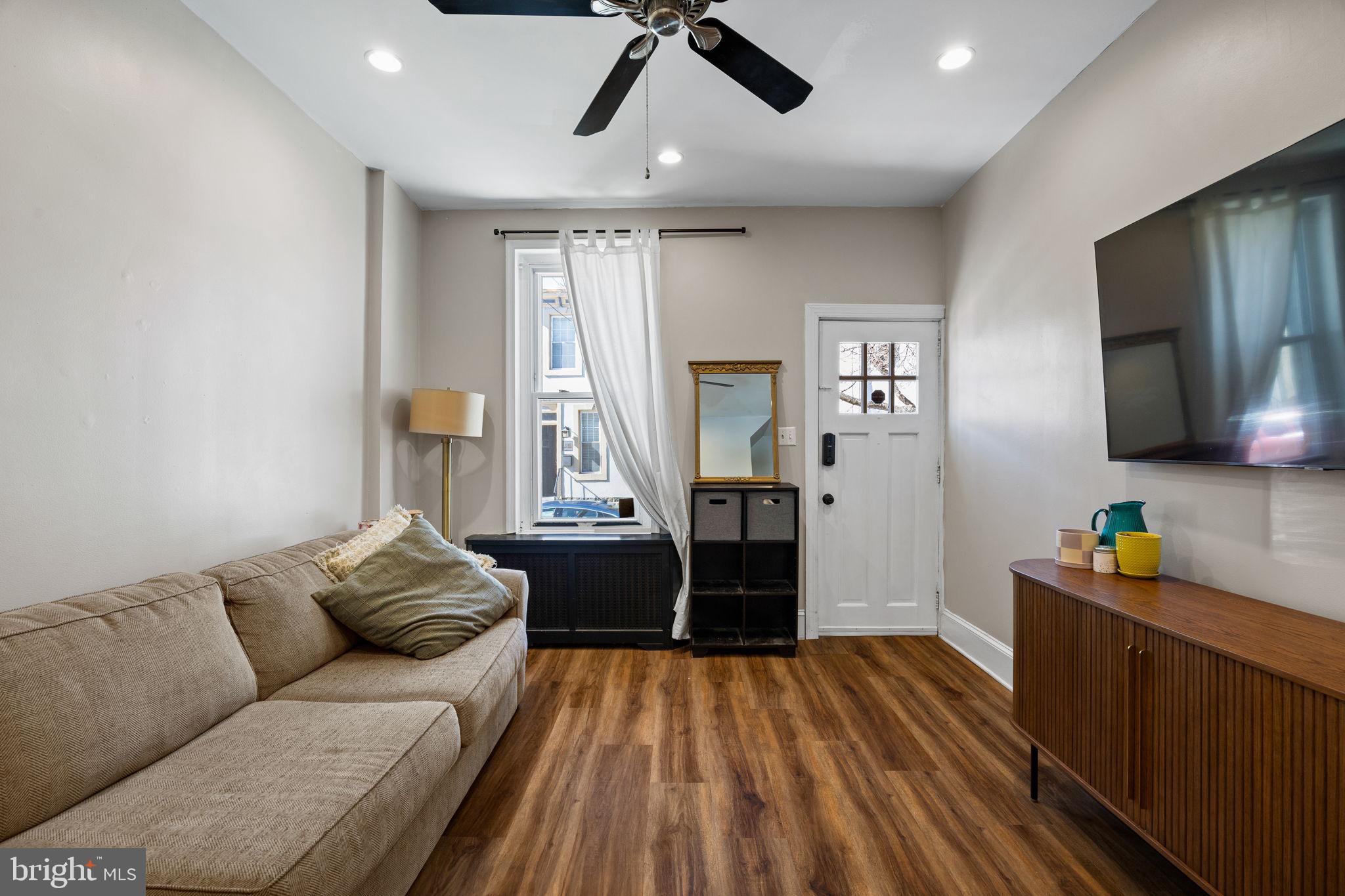 3743 Sharp Street Philadelphia, PA 19127 - Photo 2 of 25 a living room with furniture and a flat screen tv