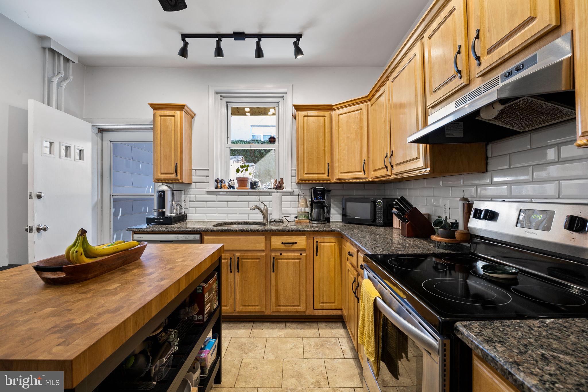3743 Sharp Street Philadelphia, PA 19127 - Photo 6 of 25 a kitchen with a sink stove and cabinets