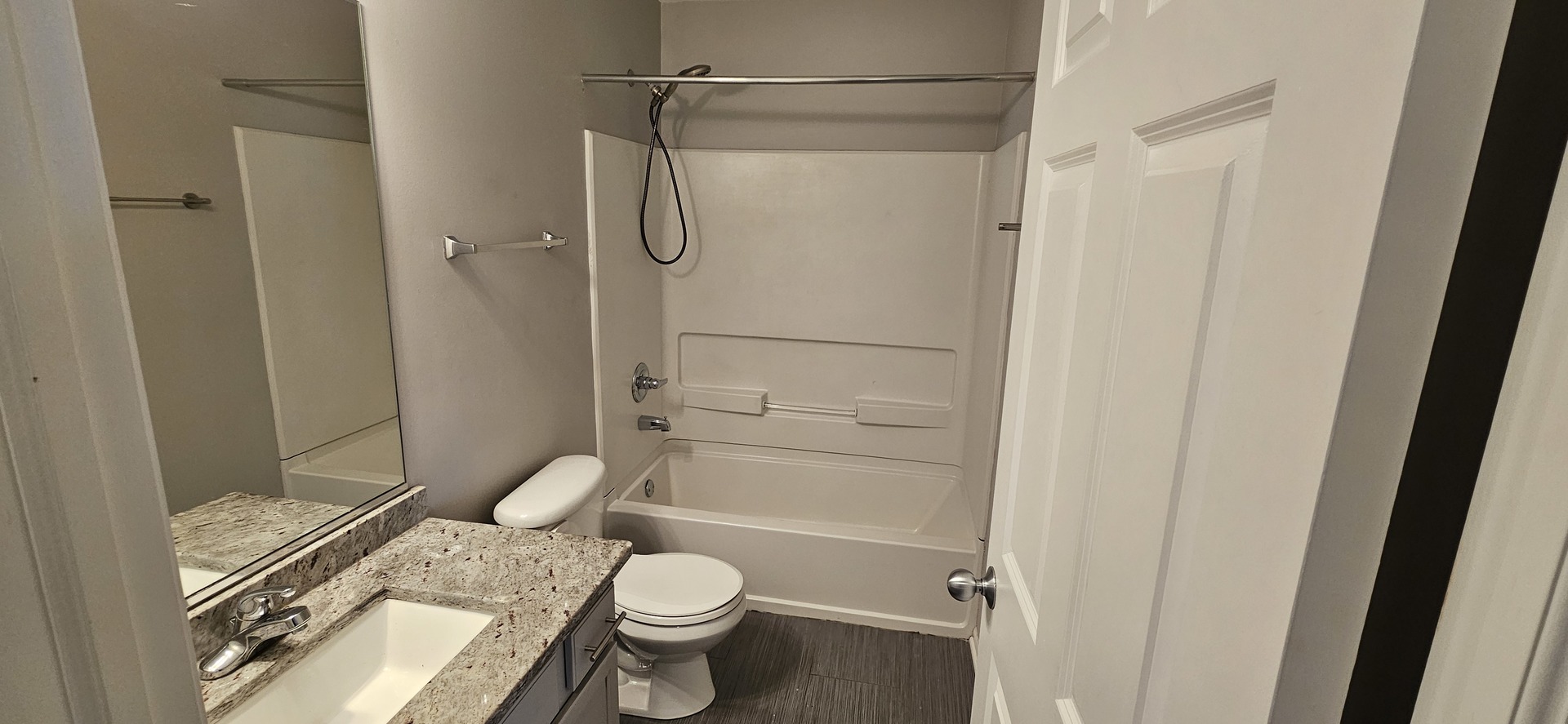 1196 Meagan Court Elgin, IL 60120 - Photo 12 of 26 a bathroom with a granite countertop toilet a sink and shower