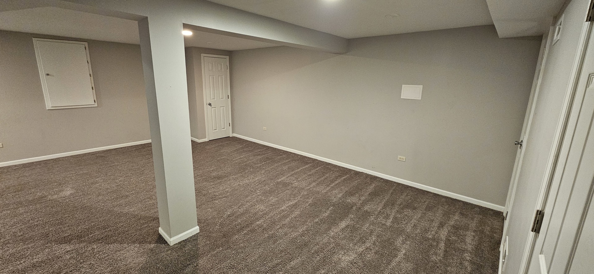 1196 Meagan Court Elgin, IL 60120 - Photo 23 of 26 an empty room with windows