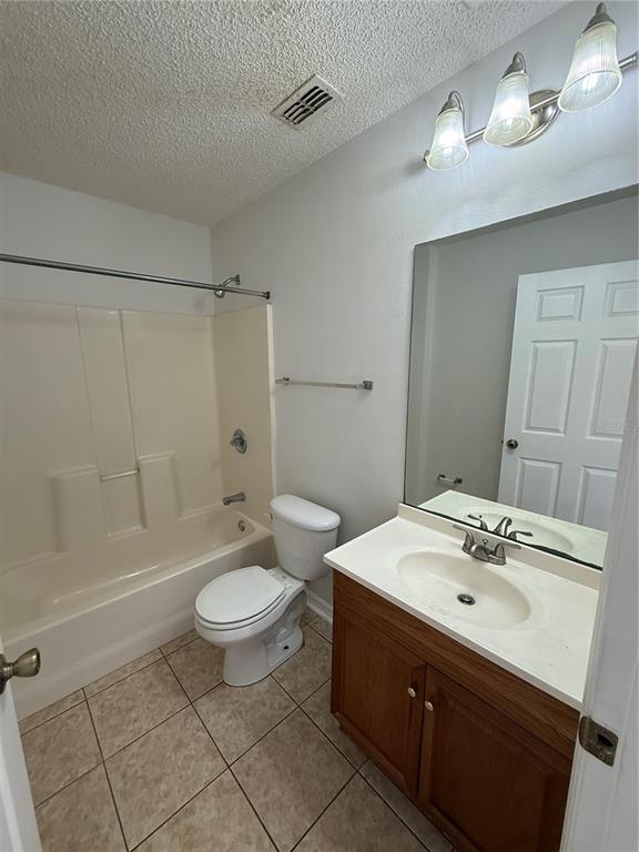 2744 Botts Landing Road, Unit 204 DeLand, FL 32720 - Photo 11 of 19 a bathroom with a sink a toilet and shower