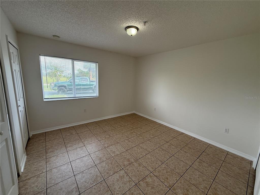 2744 Botts Landing Road, Unit 204 DeLand, FL 32720 - Photo 13 of 19 an empty room with windows