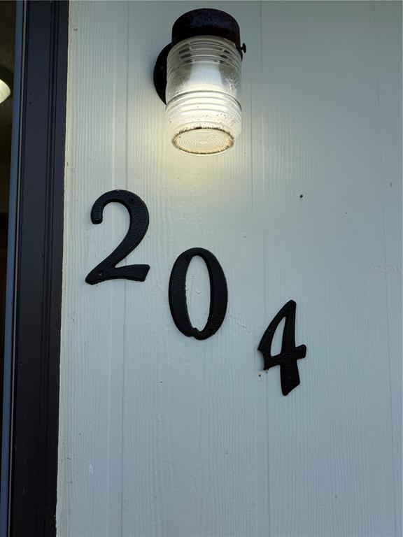 2744 Botts Landing Road, Unit 204 DeLand, FL 32720 - Photo 17 of 19 a bathroom with a sink and a mirror