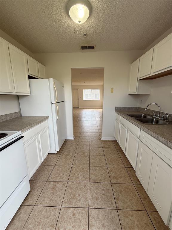2744 Botts Landing Road, Unit 204 DeLand, FL 32720 - Photo 4 of 19 a kitchen with a sink and cabinets