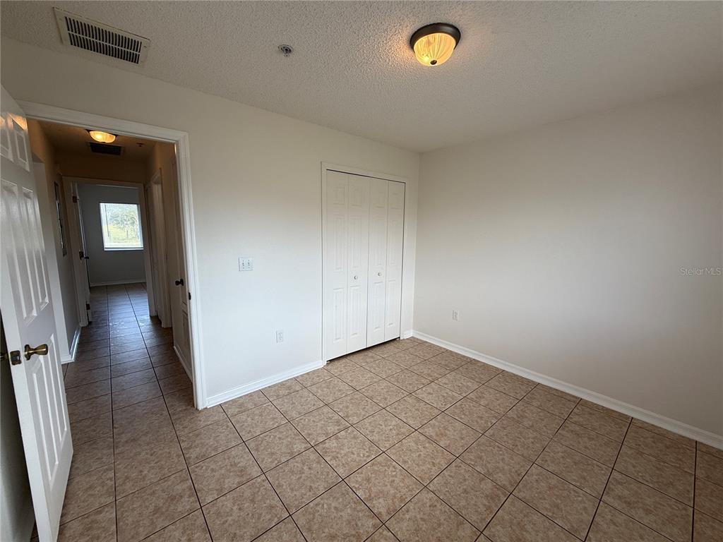 2744 Botts Landing Road, Unit 204 DeLand, FL 32720 - Photo 9 of 19 a view of a livingroom with wooden floor and a window