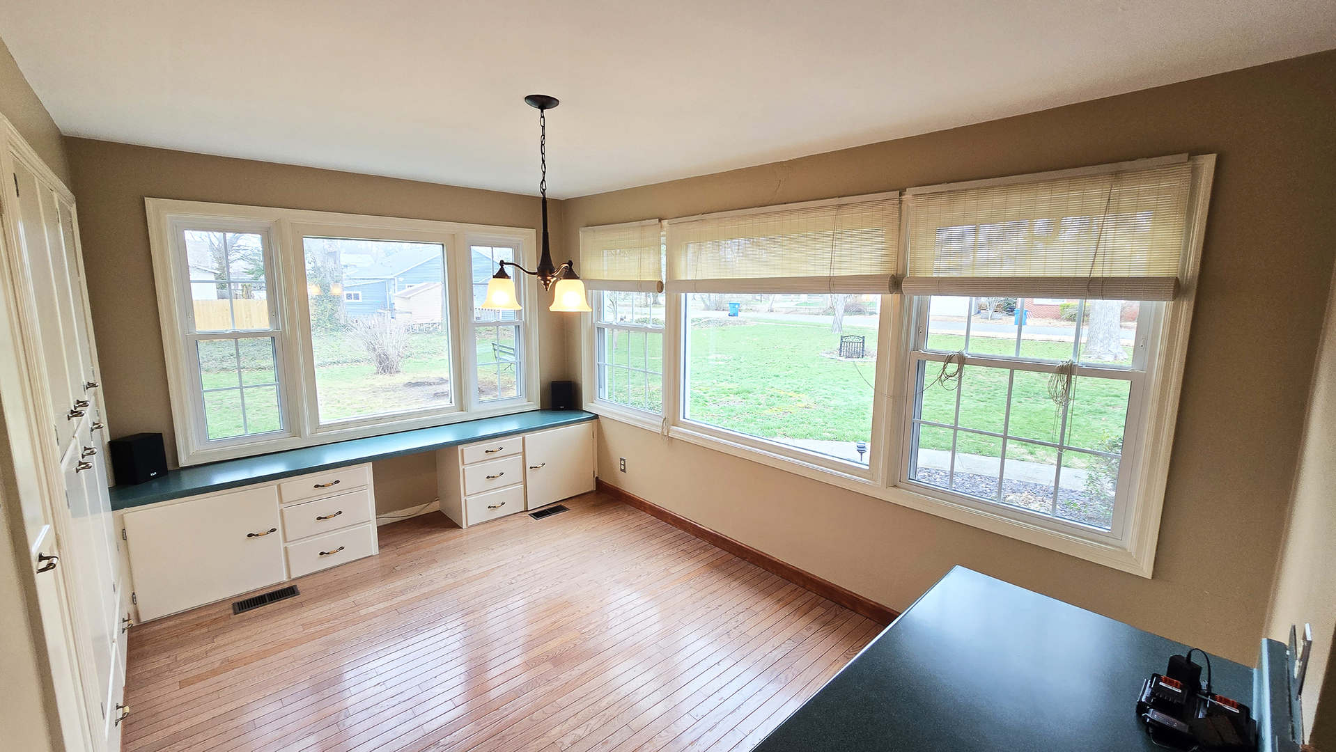 630 Short Street Centralia, IL 62801 - Photo 12 of 47 a large kitchen with kitchen island wooden floors and a large window