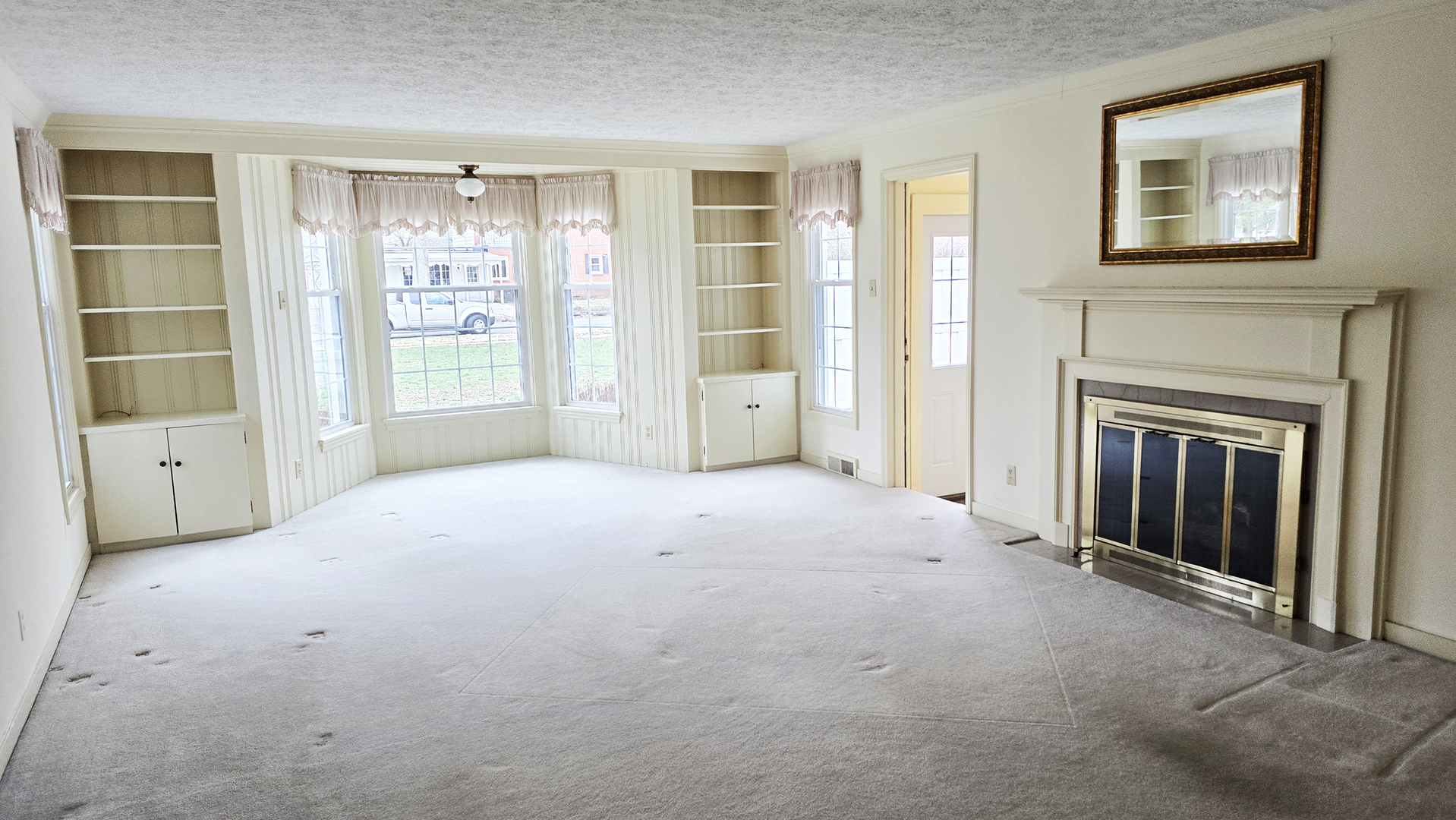 630 Short Street Centralia, IL 62801 - Photo 31 of 47 a view of an empty room with a fireplace and a window