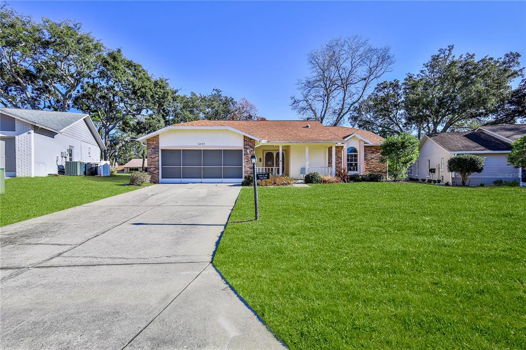 6497 Pine Meadows Drive Spring Hill, FL 34606 - Photo 4 of 52