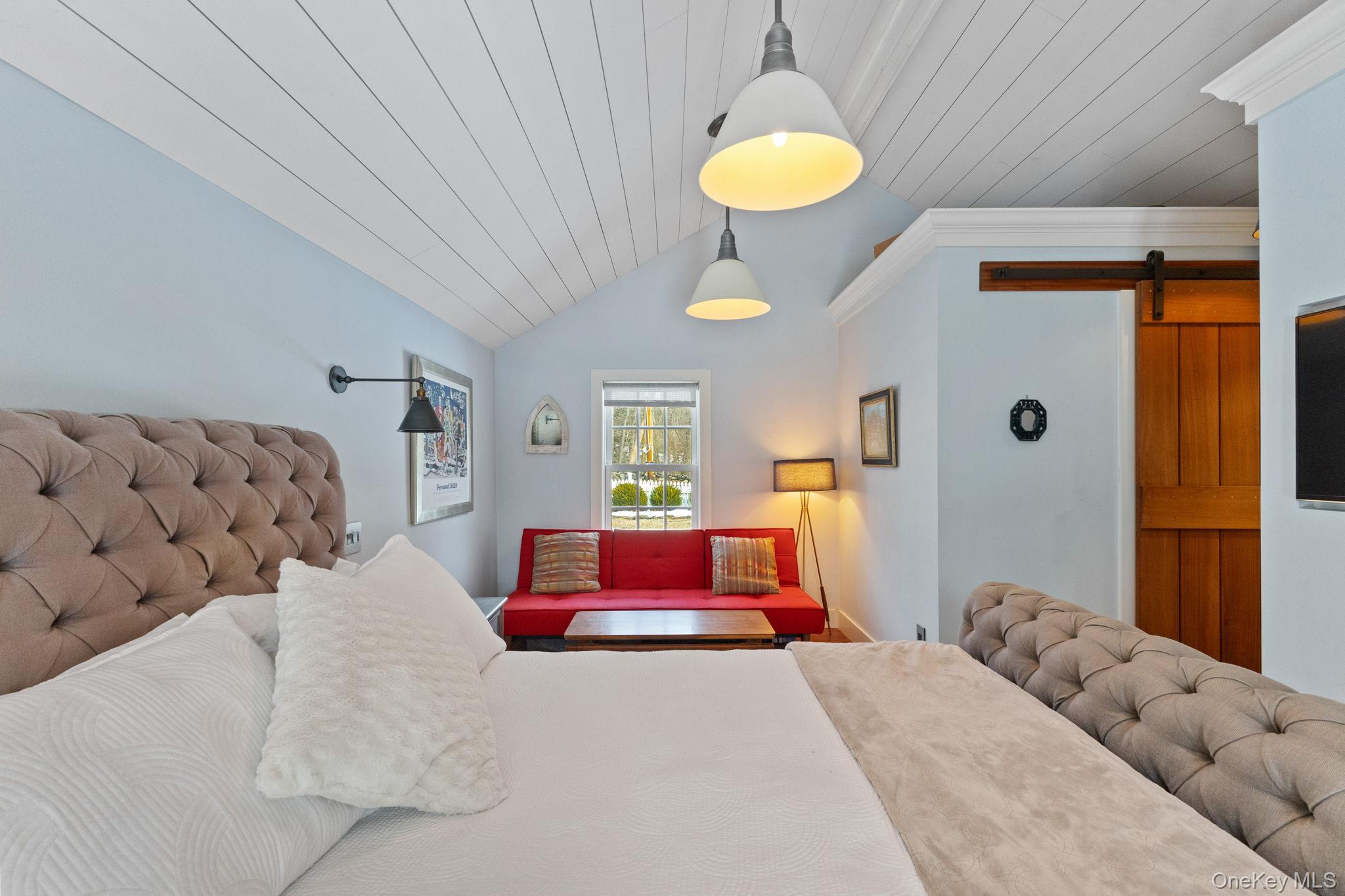 8 South Bedford Road Pound Ridge, NY 10576 - Photo 18 of 32 a bedroom with a bed couch and window