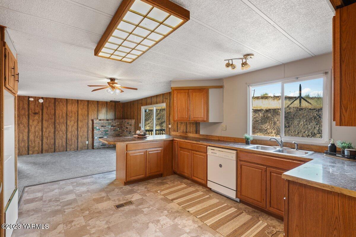 10907 Hackett Road Yakima, WA 98903 - Photo 1 of 18 a large kitchen with stainless steel appliances granite countertop a sink and cabinets