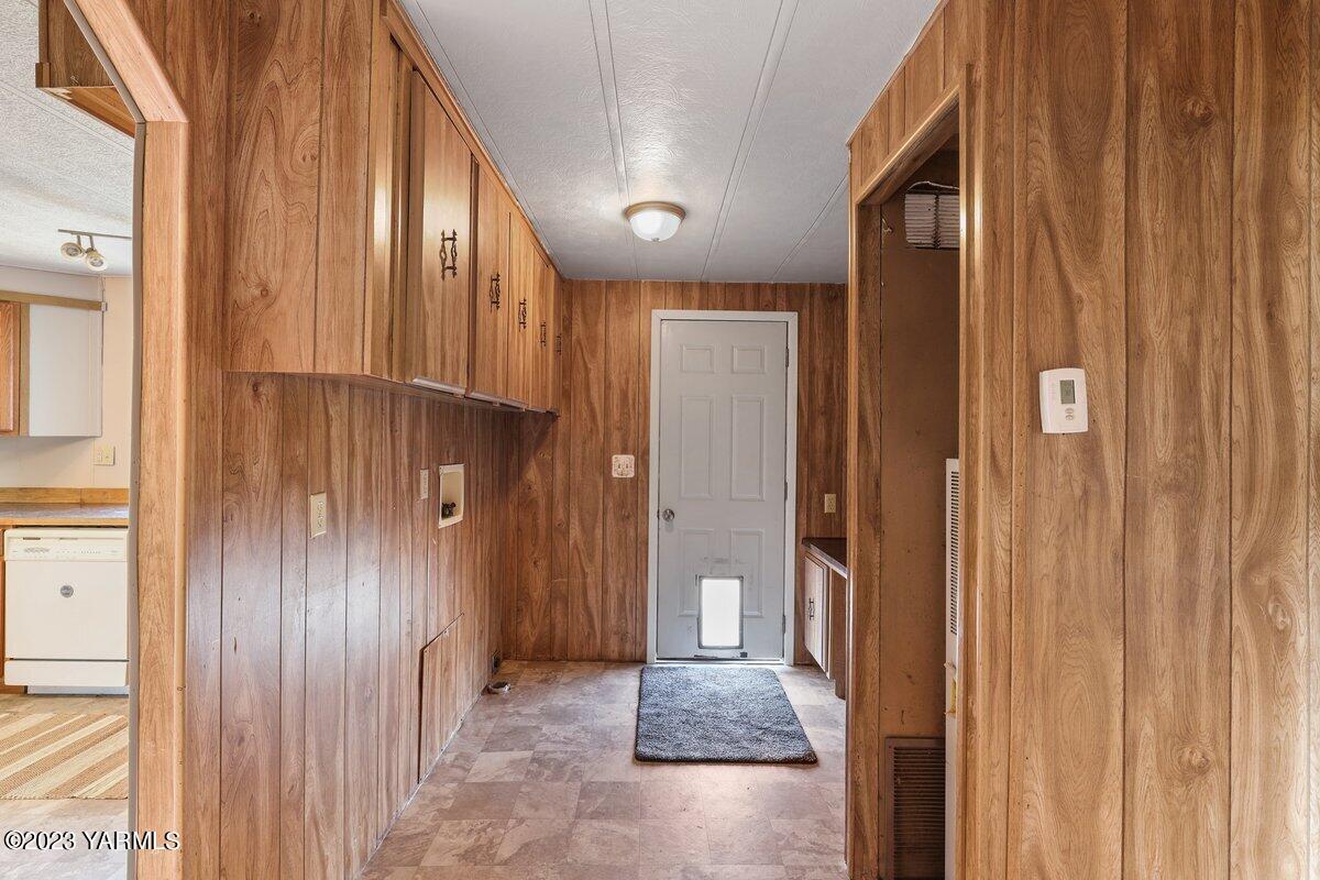 10907 Hackett Road Yakima, WA 98903 - Photo 7 of 18 a view of a hallway with wooden shelves