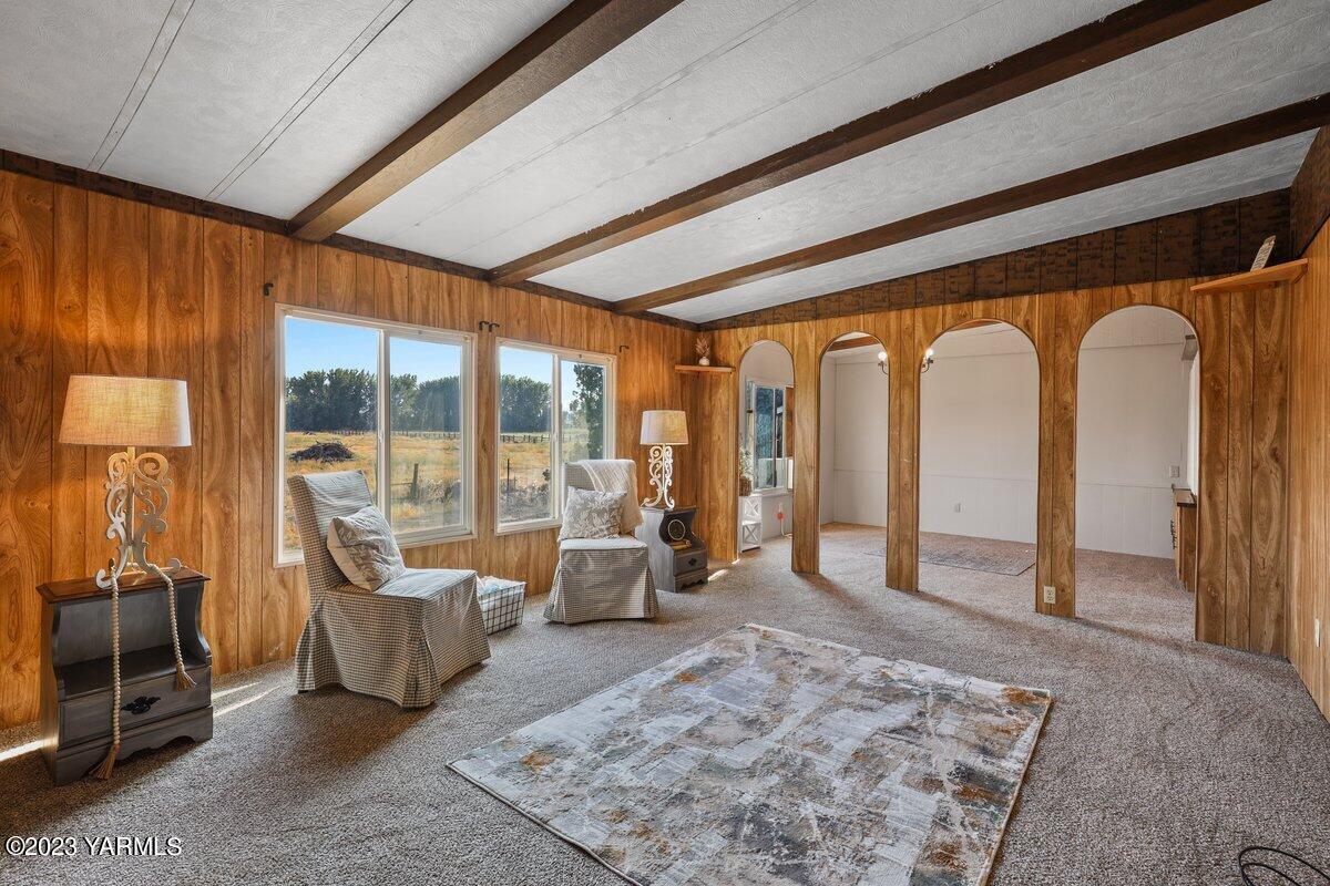 10907 Hackett Road Yakima, WA 98903 - Photo 8 of 18 a living room with furniture tv and a table