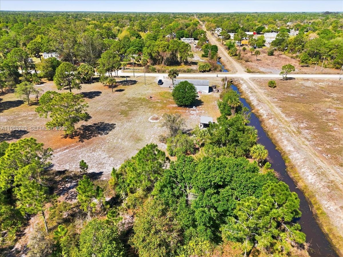 415 South Kennel Street Clewiston, FL 33440 - Photo 22 of 34 an aerial view of residential houses with outdoor space
