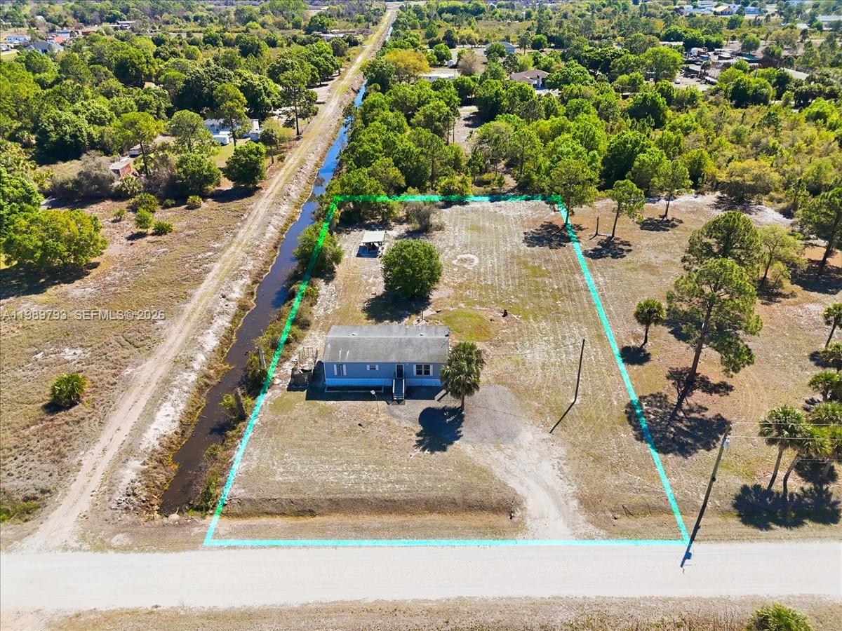 415 South Kennel Street Clewiston, FL 33440 - Photo 25 of 34 an aerial view of a house with a yard basket ball court