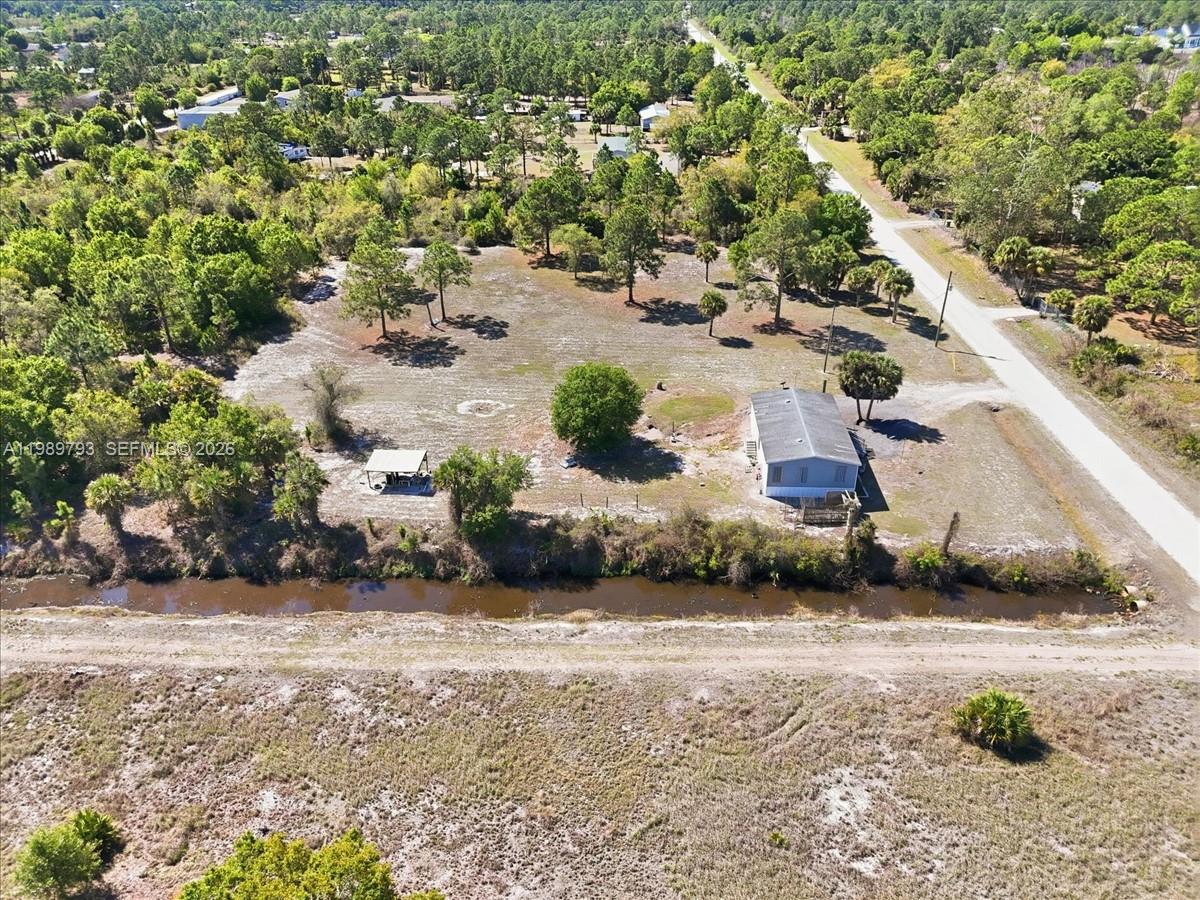 415 South Kennel Street Clewiston, FL 33440 - Photo 27 of 34 an aerial view of a house with a yard