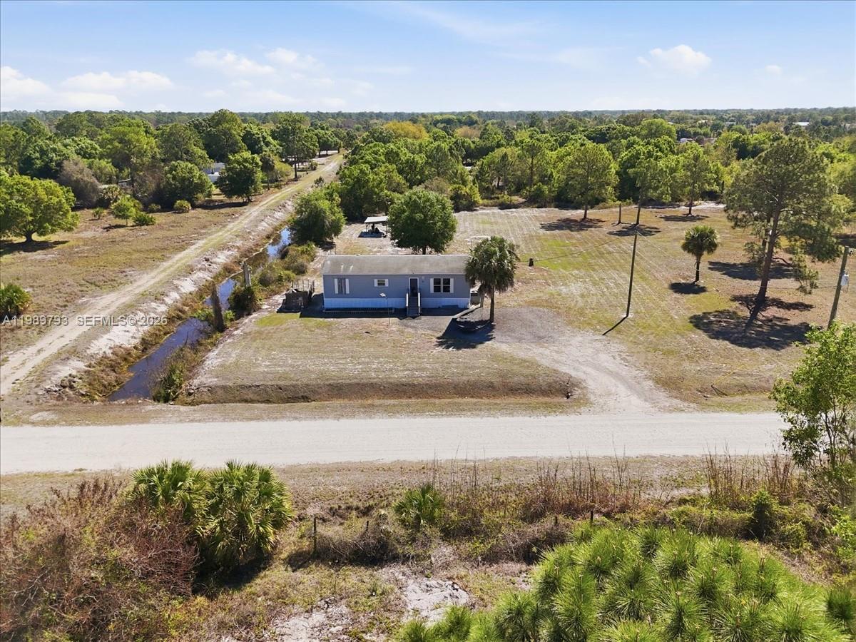 415 South Kennel Street Clewiston, FL 33440 - Photo 29 of 34 a view of a lake with a mountain in the background