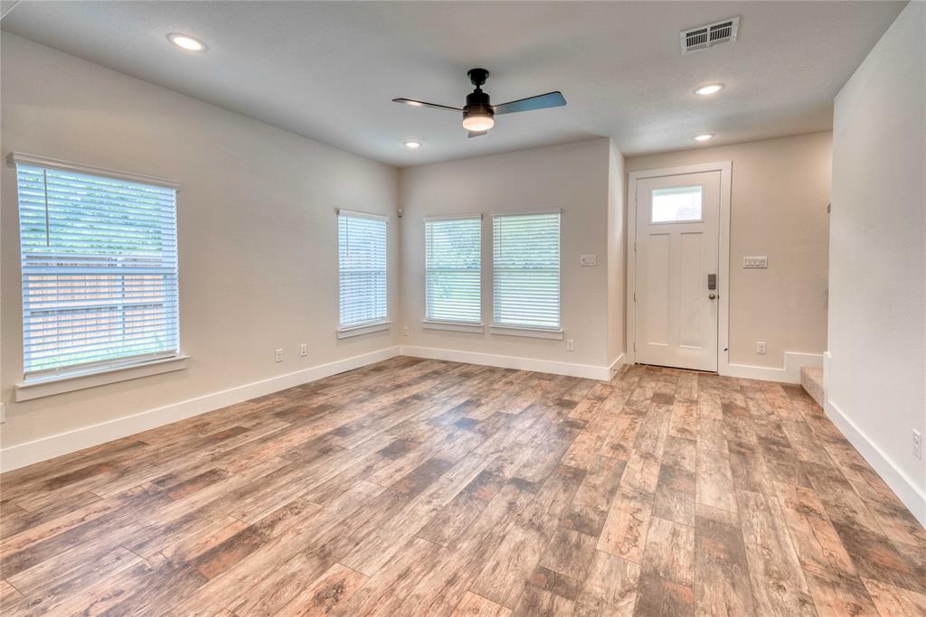 1407 Apricot Lane Gainesville, TX 76240 - Photo 2 of 9 a view of empty room with window and ceiling fan