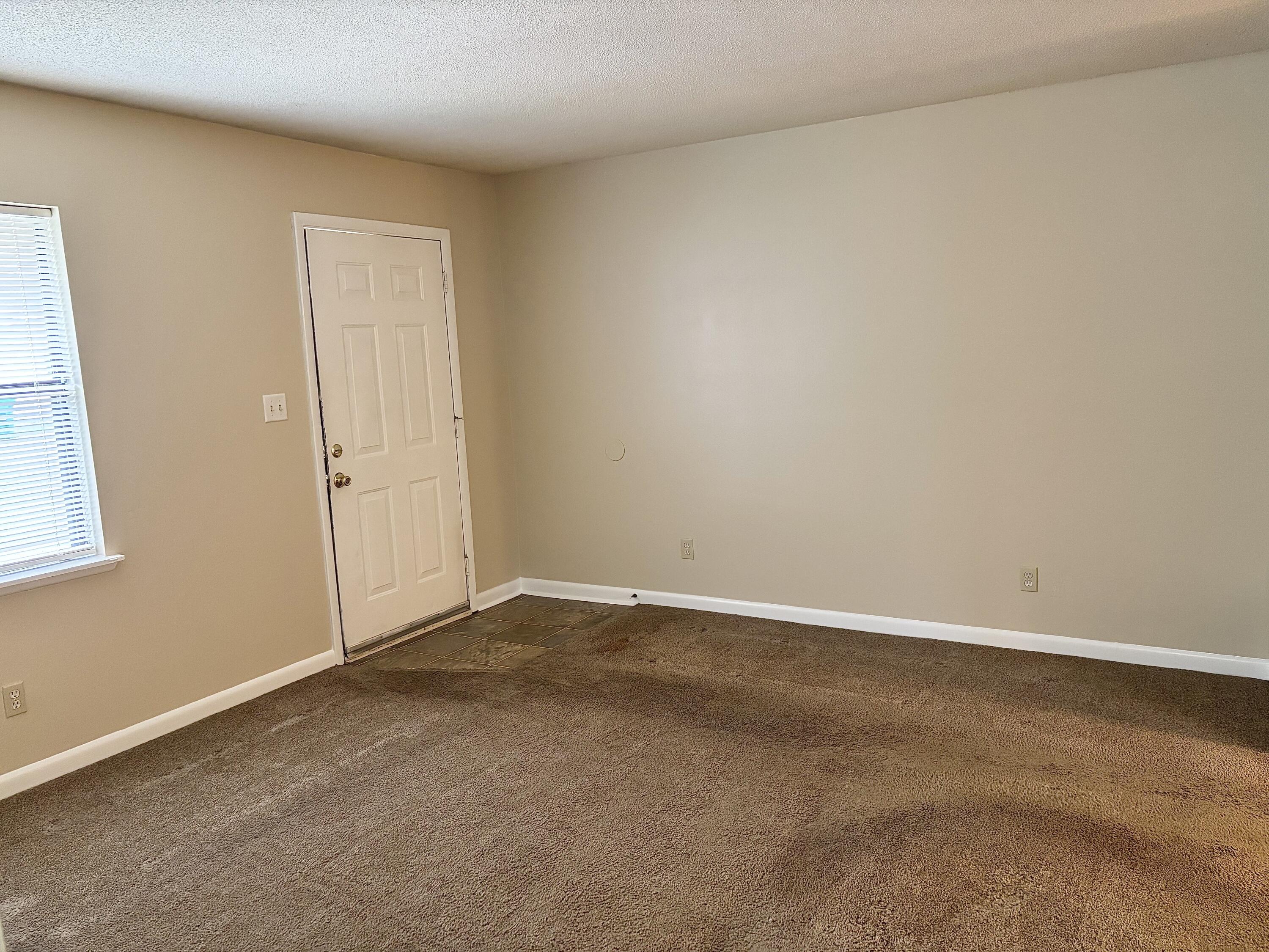 208 Squirrel Haven Road, Unit A Mary Esther, FL 32569 - Photo 8 of 13 an empty room with an entryway