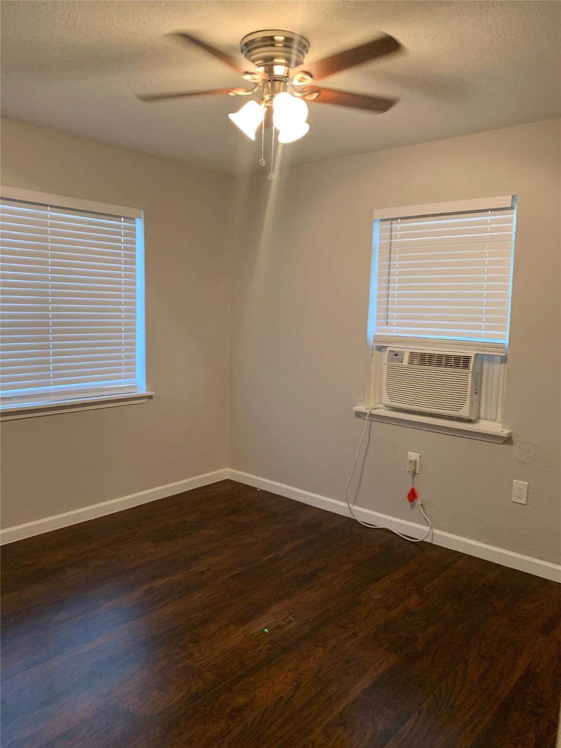 2507 Delano Street, Unit 4 Houston, TX 77004 - Photo 10 of 12 wooden floor in an empty room with a window