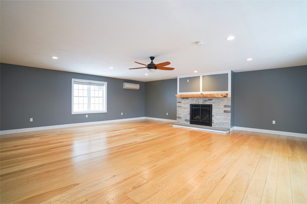 162 Fiskdale Road Brookfield, MA 01506 - Photo 14 of 42 a view of empty room with wooden floor and fireplace