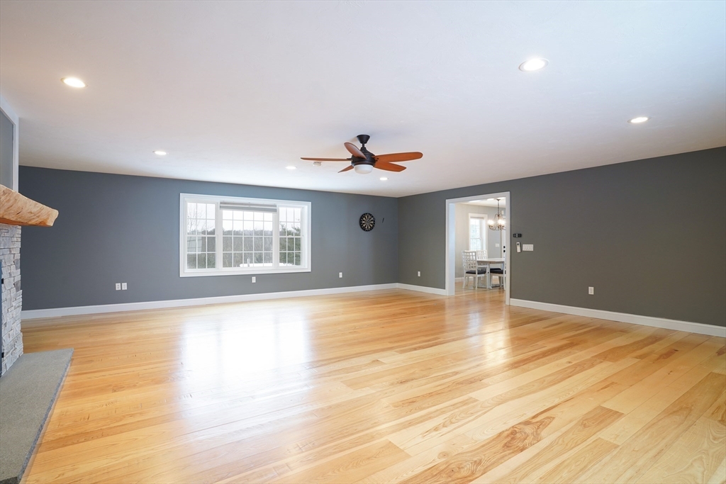 162 Fiskdale Road Brookfield, MA 01506 - Photo 15 of 42 a view of an empty room with window and wooden floor