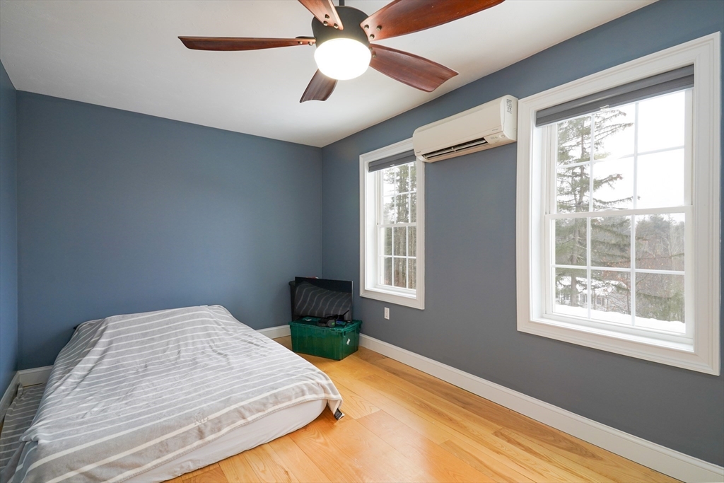 162 Fiskdale Road Brookfield, MA 01506 - Photo 16 of 42 a bedroom with a bed and a window