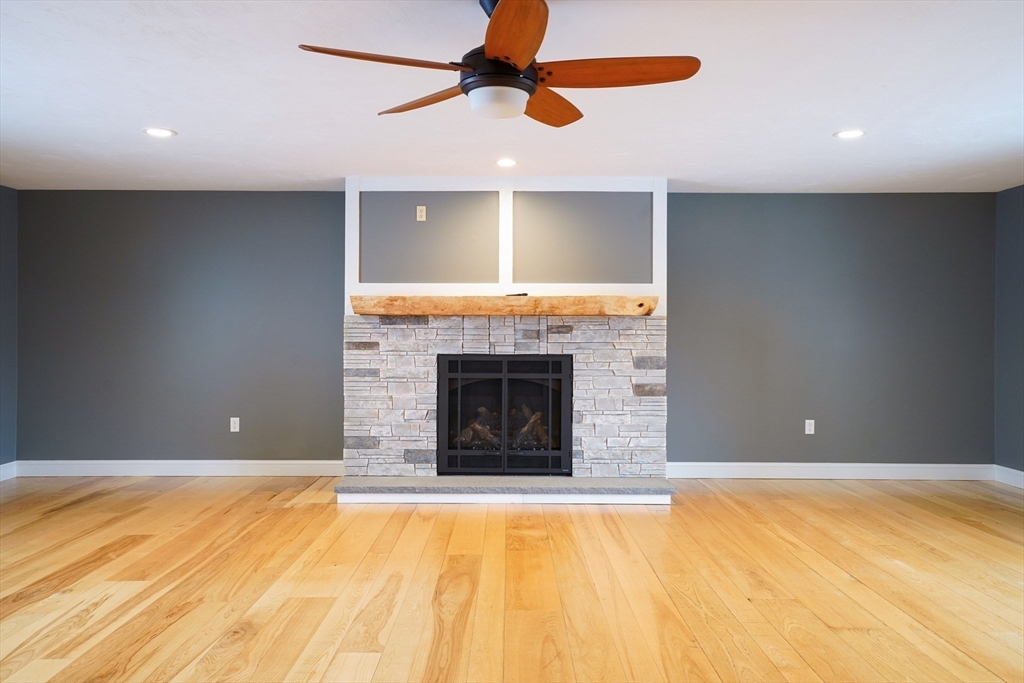 162 Fiskdale Road Brookfield, MA 01506 - Photo 17 of 42 a view of an empty room with a fireplace