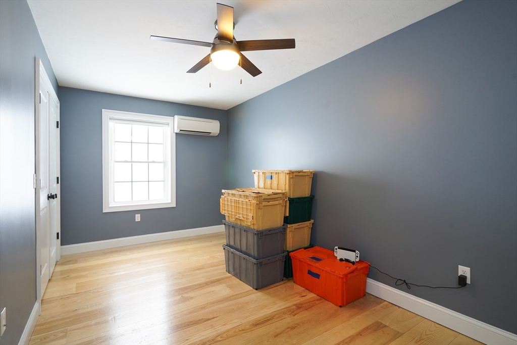 162 Fiskdale Road Brookfield, MA 01506 - Photo 20 of 42 a bedroom with a bed and wooden floor