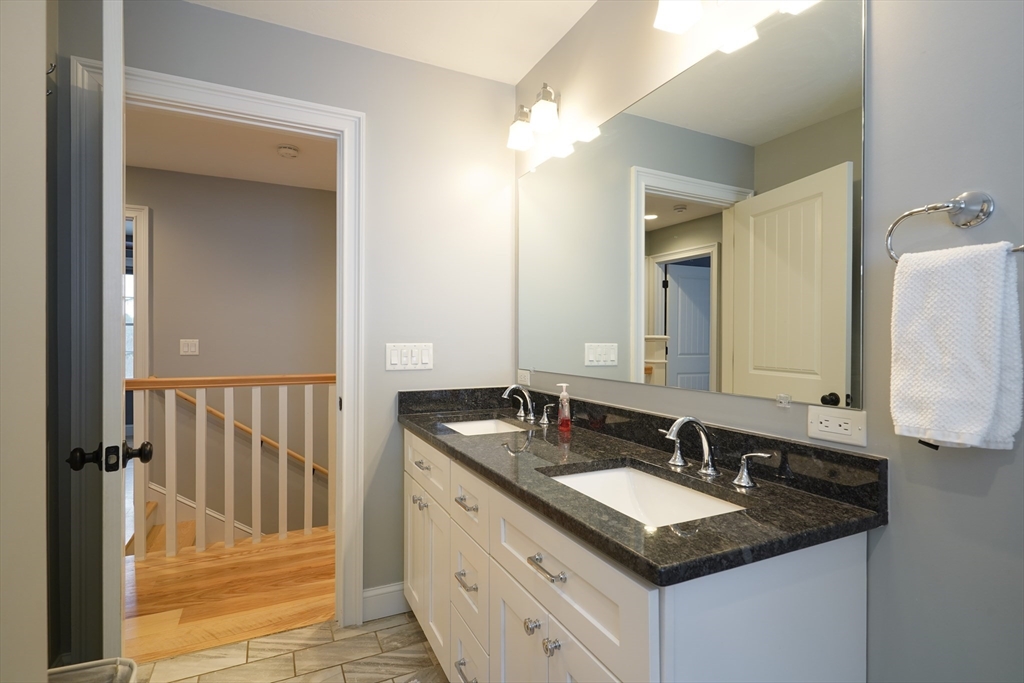 162 Fiskdale Road Brookfield, MA 01506 - Photo 24 of 42 a bathroom with a granite countertop sink and a mirror