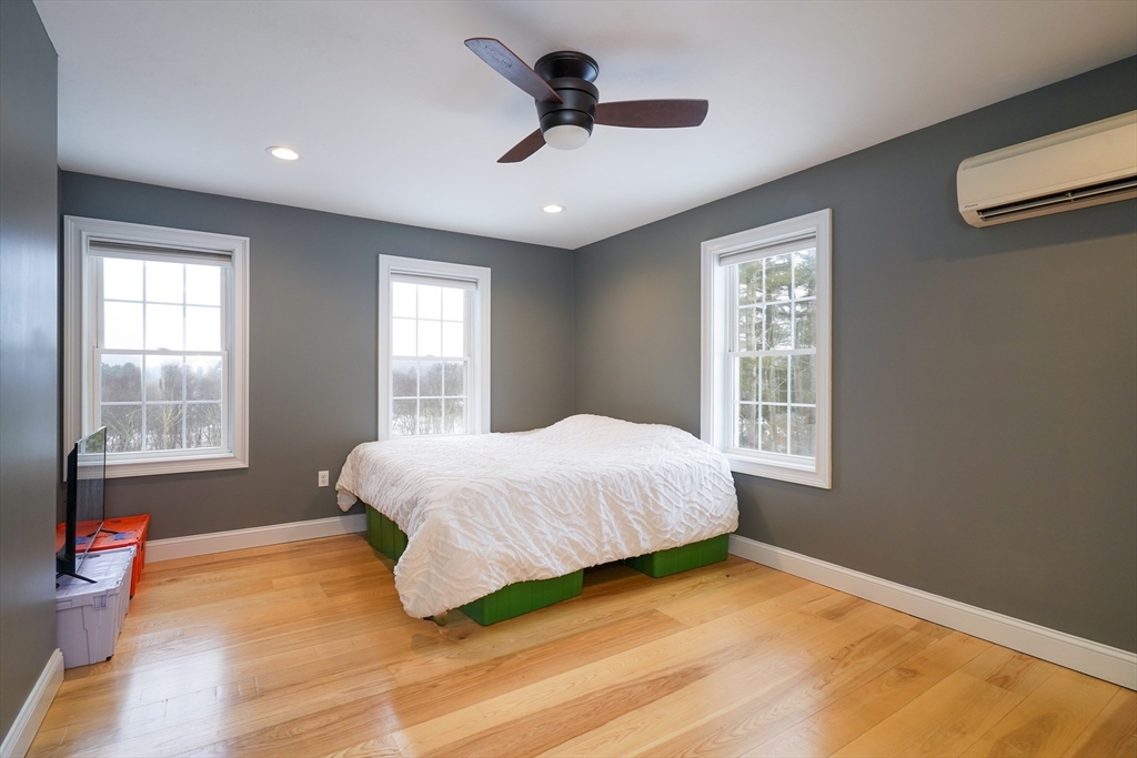 162 Fiskdale Road Brookfield, MA 01506 - Photo 25 of 42 a bedroom with a bed and a window
