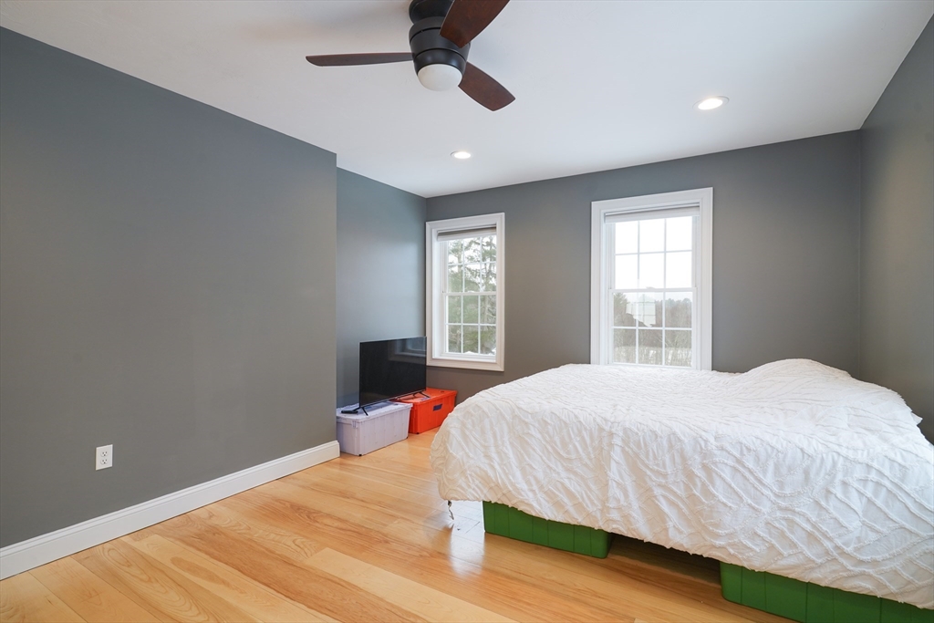 162 Fiskdale Road Brookfield, MA 01506 - Photo 26 of 42 a bedroom with a large bed and a window