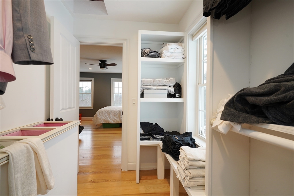 162 Fiskdale Road Brookfield, MA 01506 - Photo 28 of 42 a bedroom with a bed and a chair