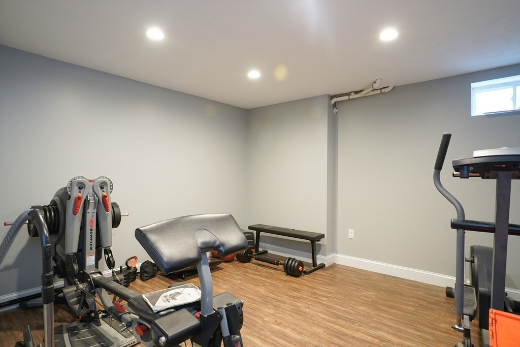 162 Fiskdale Road Brookfield, MA 01506 - Photo 32 of 42 a view of workspace with wooden floor and gym equipment