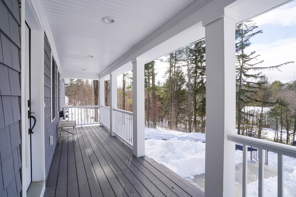 162 Fiskdale Road Brookfield, MA 01506 - Photo 38 of 42 a view of backyard with large trees and wooden fence