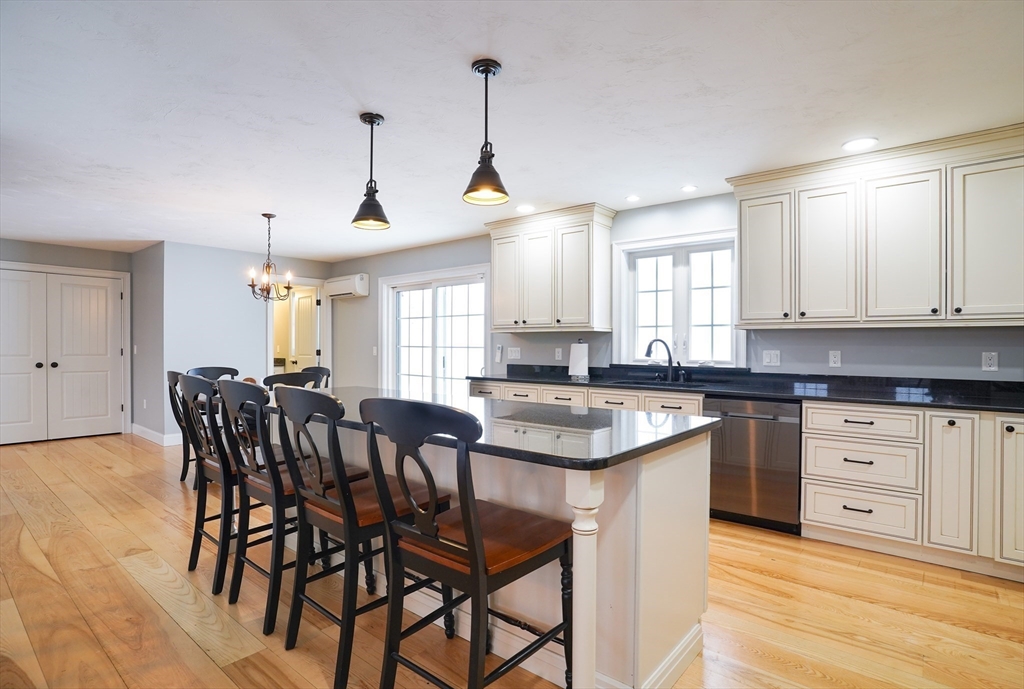 162 Fiskdale Road Brookfield, MA 01506 - Photo 4 of 42 a kitchen with stainless steel appliances granite countertop a sink a stove a dining table and chairs