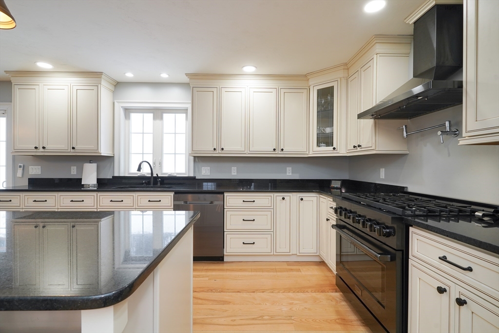 162 Fiskdale Road Brookfield, MA 01506 - Photo 5 of 42 a kitchen with stainless steel appliances granite countertop a sink stove and cabinets