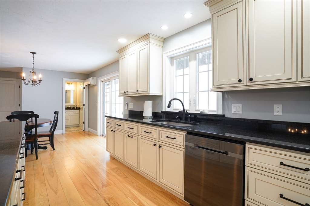 162 Fiskdale Road Brookfield, MA 01506 - Photo 6 of 42 a kitchen with granite countertop white cabinets and white appliances