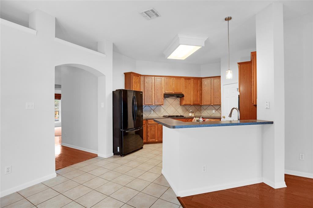 281 Hutton Kyle, TX 78640 - Photo 16 of 37 A well-equipped culinary space offers generous cabinetry and integrated appliances.