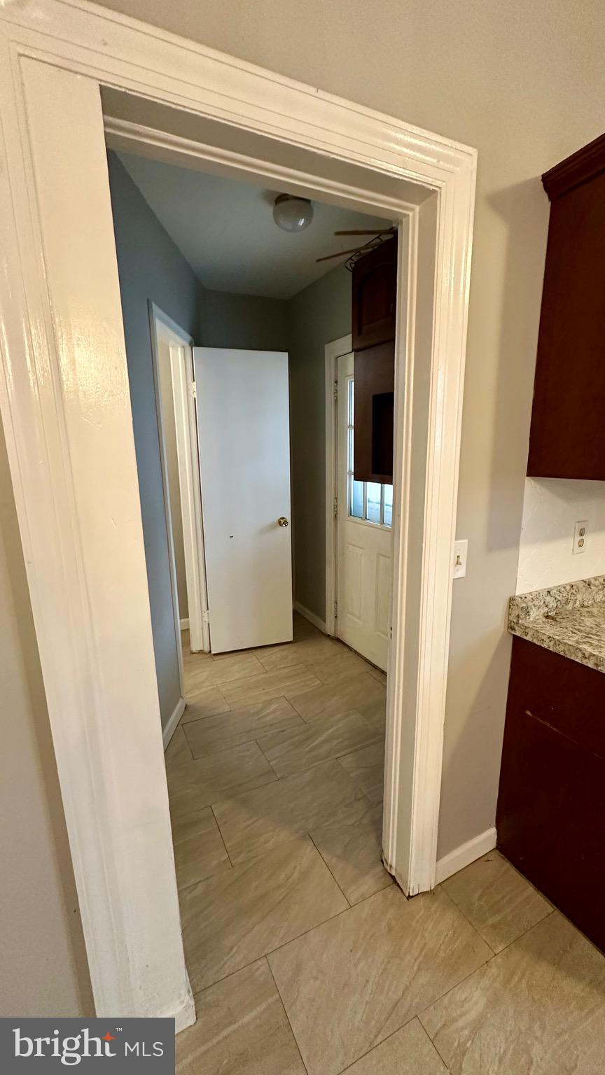 330 Kossuth Street Riverside, NJ 08075 - Photo 6 of 20 a view of an empty room and wooden floor