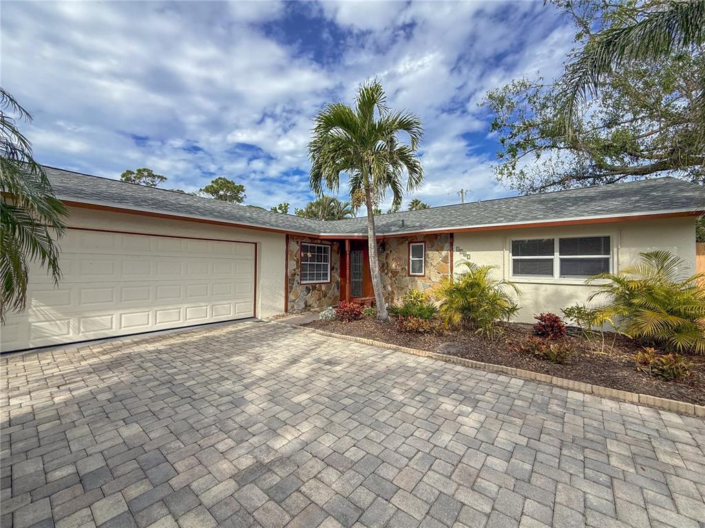 1887 Rita Street Sarasota, FL 34231 - Photo 1 of 1 a front view of a house with garden