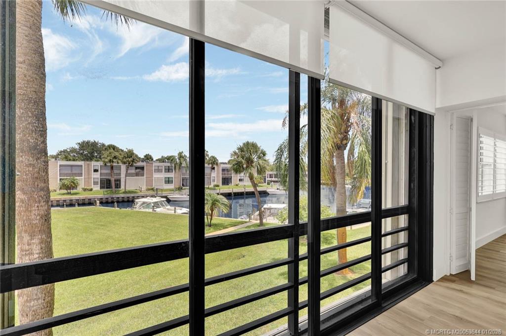1950 Southwest Palm City Road, Unit 3201 Stuart, FL 34994 - Photo 11 of 28 a view of large windows and lake view