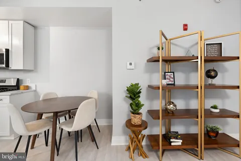 a view of a room with furniture and wooden floor